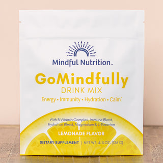 A resealable pouch of GoMindfully drink mix by Mindful Nutrition in lemonade flavor, with branding and product information displayed on the front.