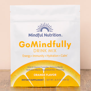 A resealable pouch of GoMindfully Orange drink mix by Mindful Nutrition, with orange flavor indicated on the packaging.