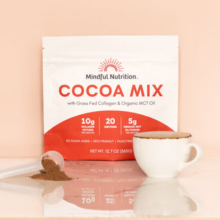 Mindful Nutrition Cocoa Mix with grass-fed collagen and organic MCT oil, displayed with ceramic mug and scoop of cocoa powder